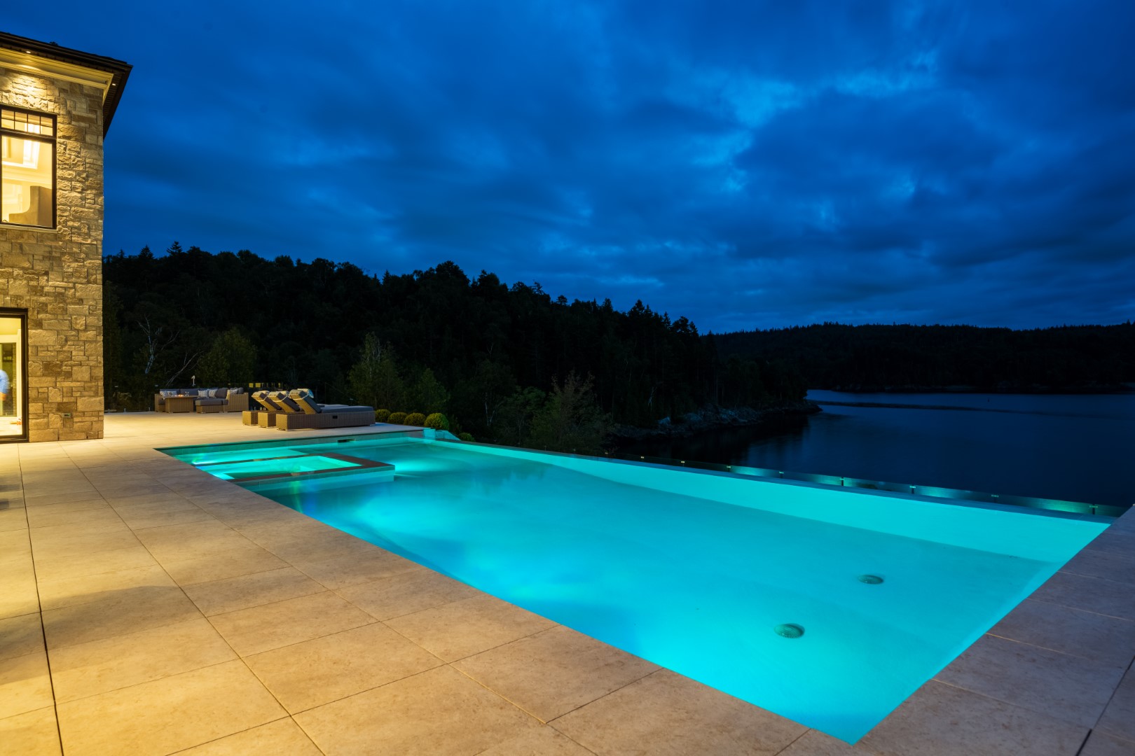 Concealed edge large luxury swimming pool for home in Saint John with underwater lighting