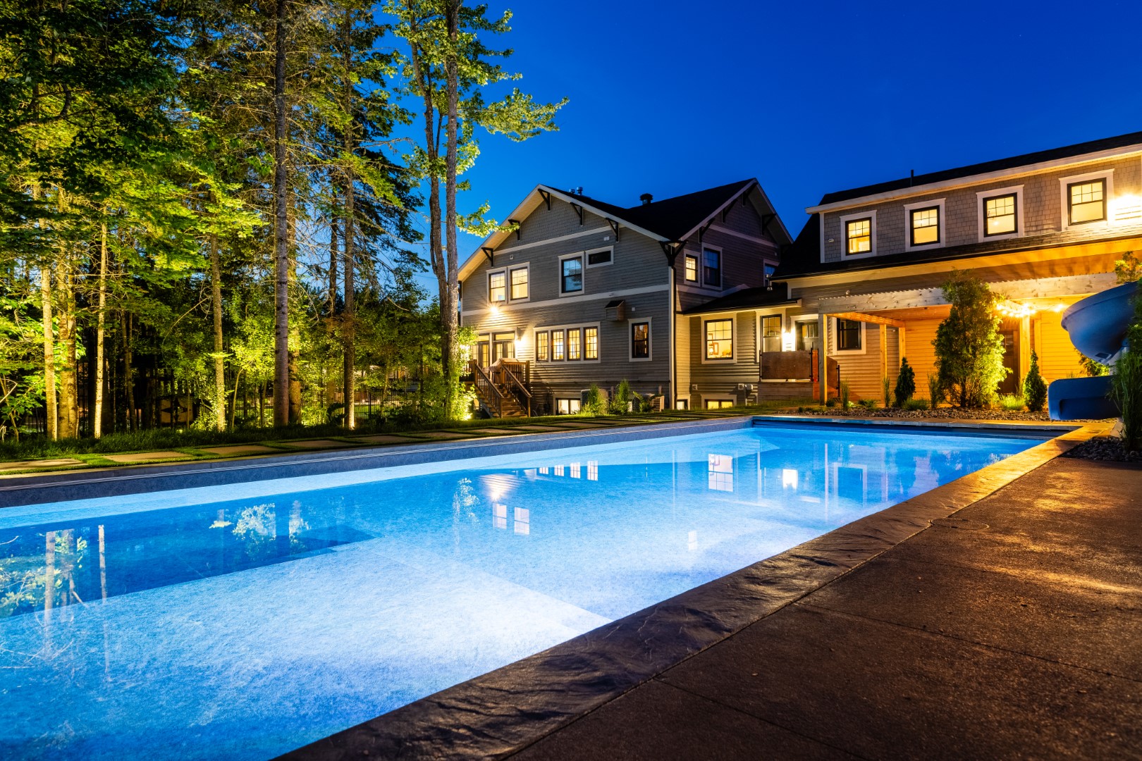 Pool with underwater lighting at Moncton residence showing installation at night