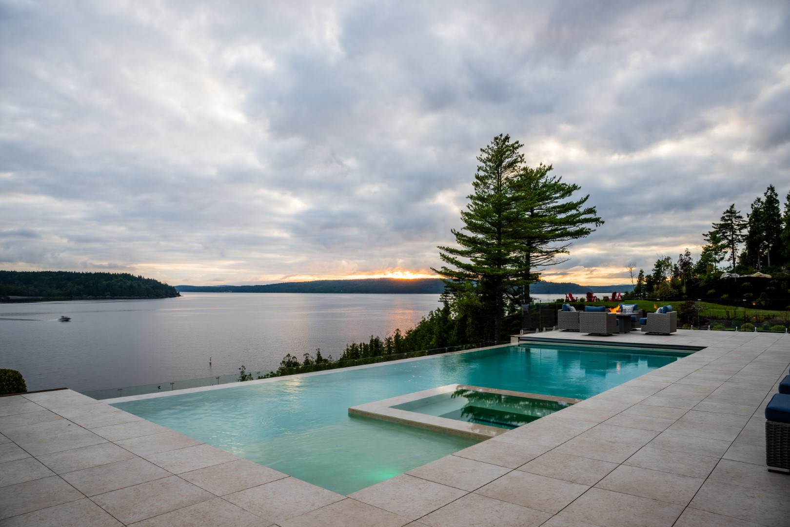 Saint John landscape with luxury concealed edge pool, hot tub and fire pit patio