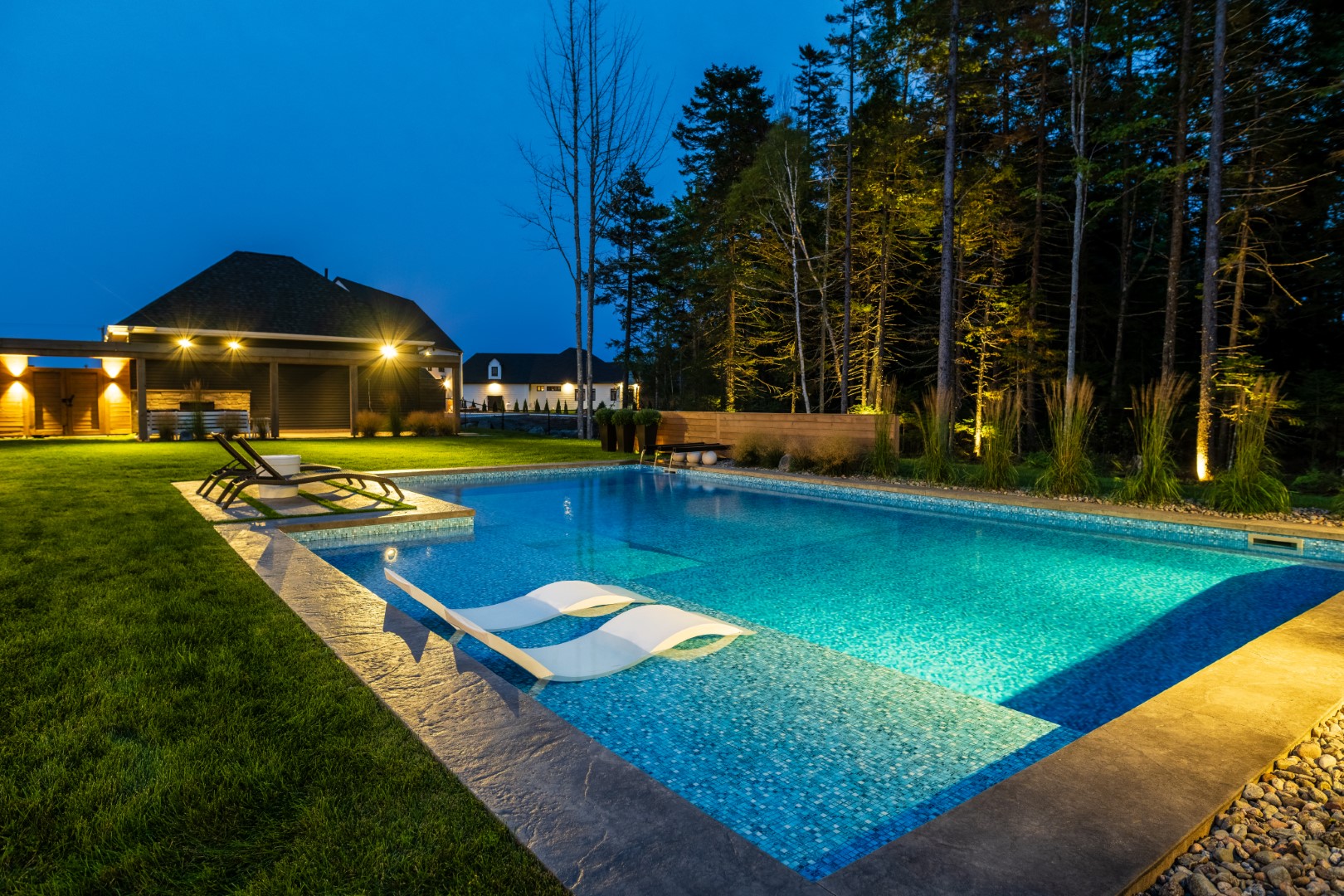 Commericial outdoor pool at night with lighting features, Atlantic Canada