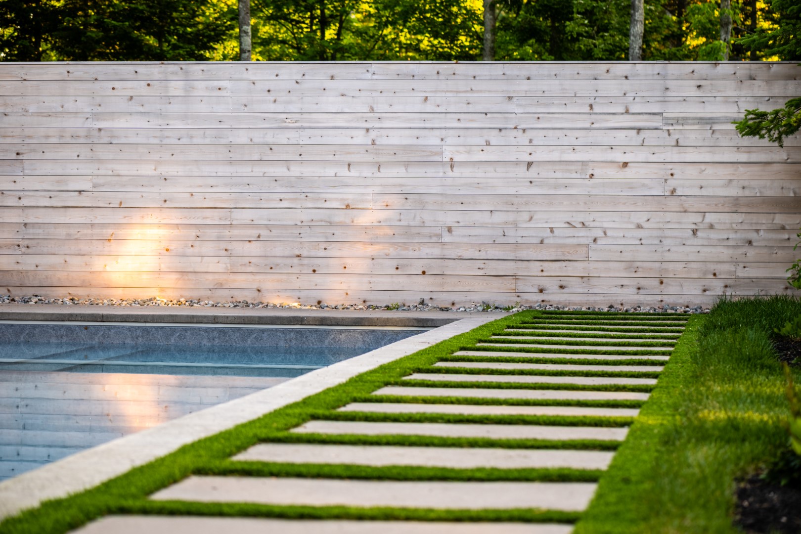 Stepping stone path next to Moncton home swimming pool 