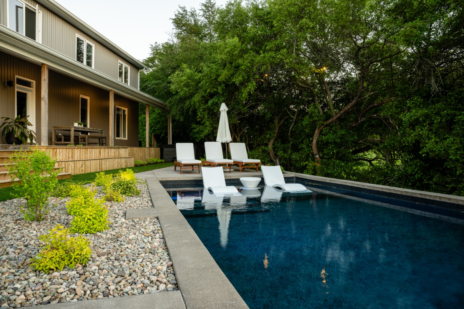 Pool with tanning ledge installed in Sussex back garden