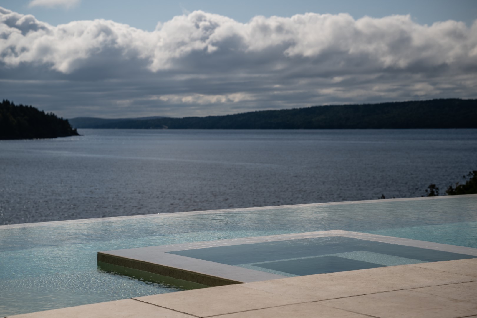 Hot tub installation as part of luxury pool design and installation in Saint John