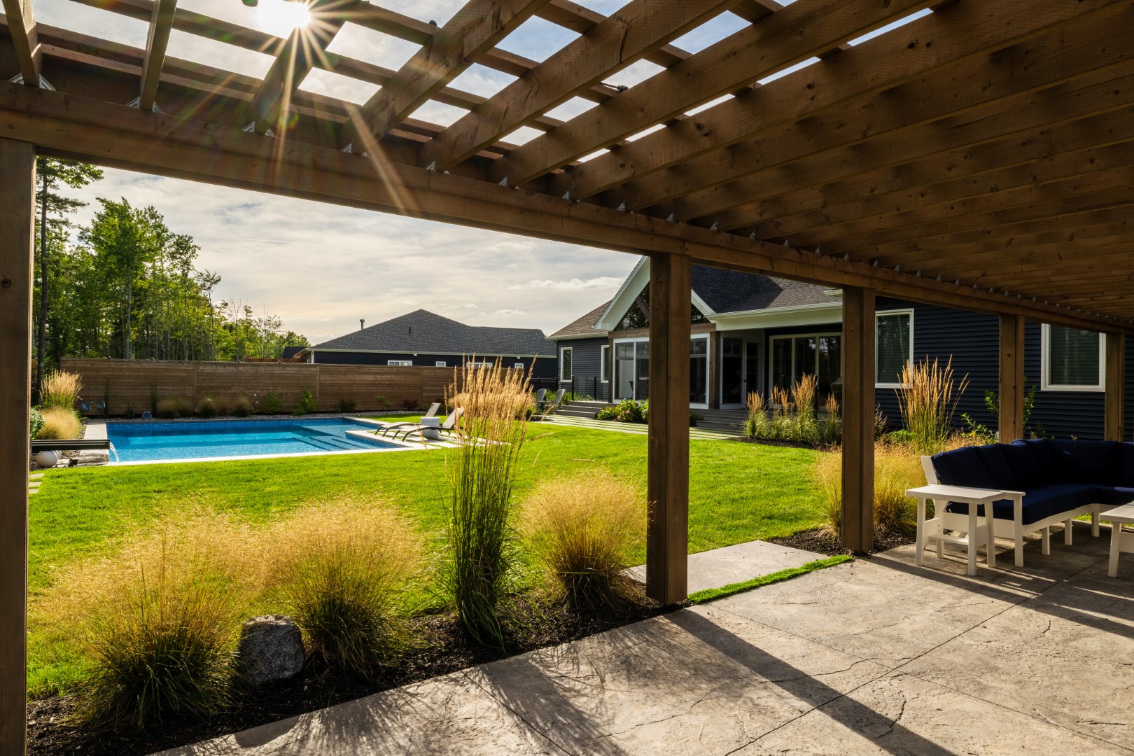 Moncton back garden home swimming pool shot showing seamless fit to lawn