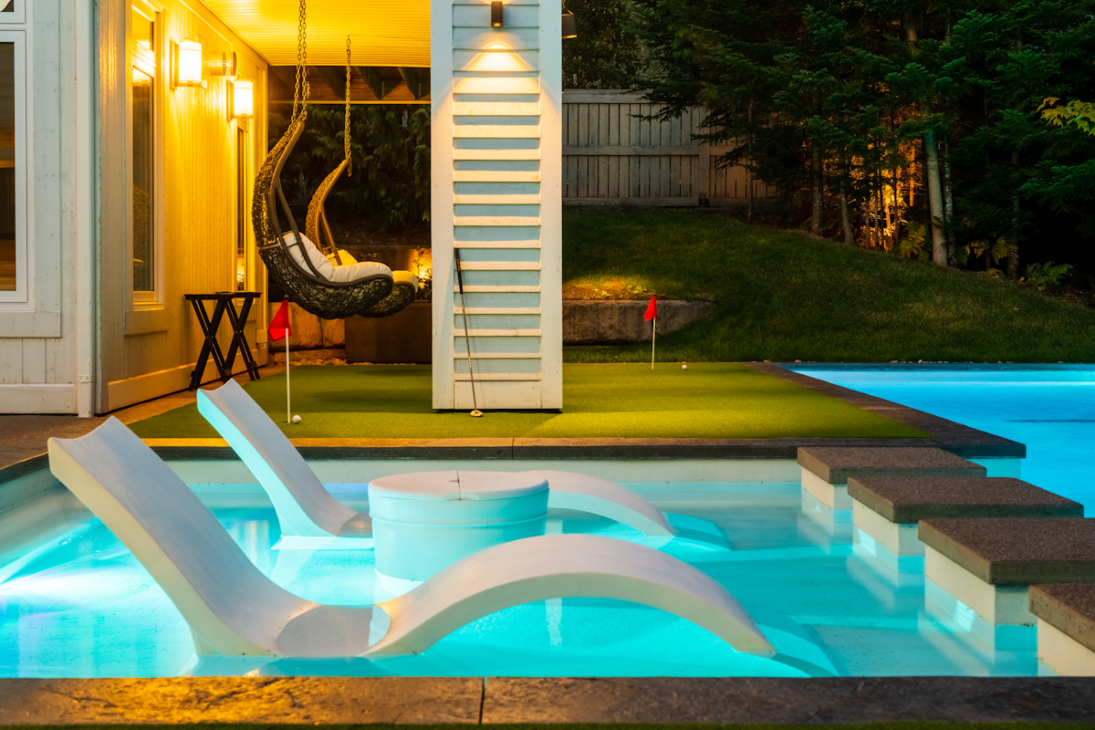Tanning ledge swimming pool in Atlantic Canada with underwater lighting