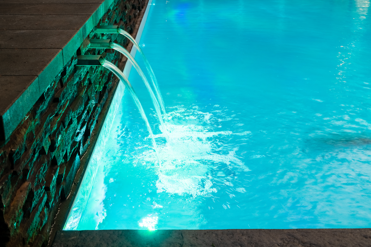 Custom water feature for a pool - three stream waterfall